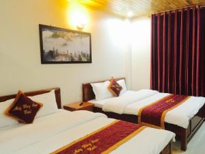 Postel nebo postele na pokoji v ubytování May Hong Hotel + 25 fotografií