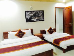 Postel nebo postele na pokoji v ubytování May Hong Hotel