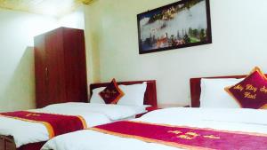 Postel nebo postele na pokoji v ubytování May Hong Hotel