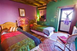 Posteľ alebo postele v izbe v ubytovaní Hotel Rural Casa de Las Campanas