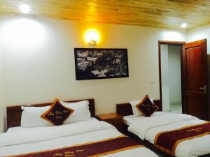 Postel nebo postele na pokoji v ubytování May Hong Hotel