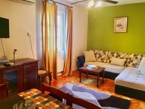 a living room with a couch and a table at Apartments Old Town in Budva