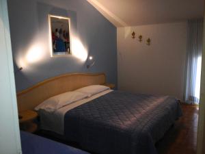 Postel nebo postele na pokoji v ubytování Le Stanze del Pescatore