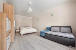 เตียงในห้องที่ Apartamenty Sun & Snow Szkolna