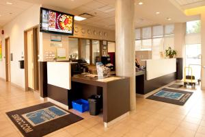 a lobby of a fast food restaurant with a counter at Residence & Conference Centre - Kamloops in Kamloops