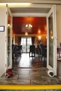 a dining room with a table and chairs at Loch Ness Guest House in Fort Augustus