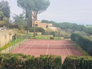 a tennis court in front of a house at Rome Guest Hospitality in Rome