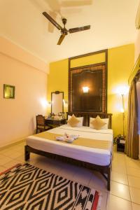 Postel nebo postele na pokoji v ubytování Hotel Coorg International