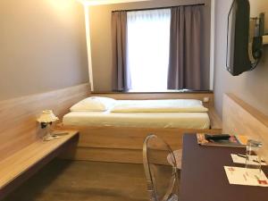Televízia a/alebo spoločenská miestnosť v ubytovaní Altstadthotel Kasererbräu