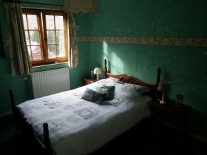Postel nebo postele na pokoji v ubytování Chambre d'hotes du Tailfer