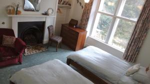 Postel nebo postele na pokoji v ubytování Greystones B&B