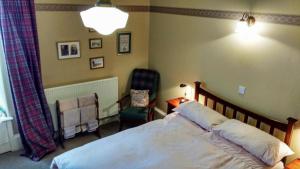 Postel nebo postele na pokoji v ubytování Greystones B&B