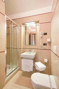 a bathroom with a sink and a shower and a toilet at Hotel Marco Polo Rome in Rome
