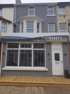 a building with a sign that reads the stranded hotel at The Stranded Hotel in Blackpool