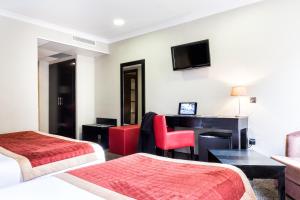 TV a/nebo společenská místnost v ubytování Hotel De Suède