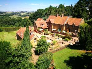 an aerial view of a large house at Heath Farm Holiday Cottages in Swerford