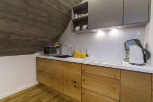Kuchyňa alebo kuchynka v ubytovaní Apartamenty Pod Giewontem