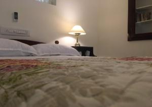 Postel nebo postele na pokoji v ubytování Padamadan homestay