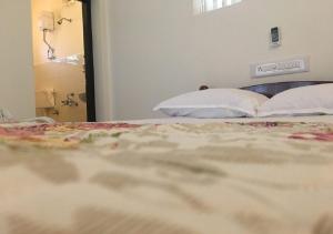 Postel nebo postele na pokoji v ubytování Padamadan homestay