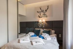 Posteľ alebo postele v izbe v ubytovaní Apartamenty Pod Giewontem