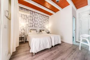 Кровать или кровати в номере Dulce Nombre Hotel - Apartamentos