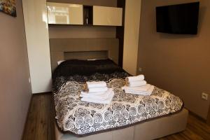 Posteľ alebo postele v izbe v ubytovaní Apartamenty Pod Giewontem