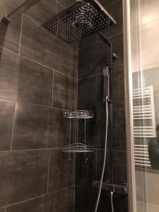 a shower with a glass door in a bathroom at Le Mattoni 2 in Menton +43 photos