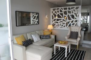 a living room with a couch and a chair at RANCHO MIRAFLORES LUXURY & DESING SEA VIEW in La Cala de Mijas