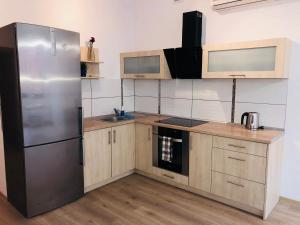 Kuchyňa alebo kuchynka v ubytovaní Apartamenty Szabla Bydgoszcz