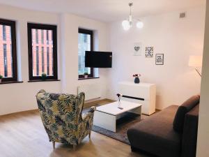 Televízia a/alebo spoločenská miestnosť v ubytovaní Apartamenty Szabla Bydgoszcz