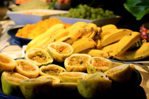 a plate of bananas and other fruit on a table at Tivoli Ecoresort Praia do Forte in Praia do Forte