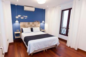 Cama o camas de una habitación en La Casa de la Alameda