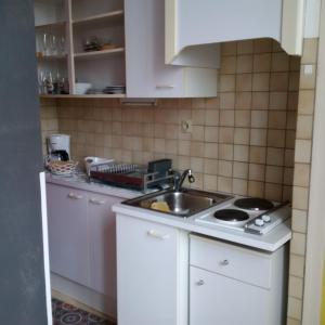 Dapur atau dapur kecil di Residence du marche