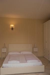 Llit o llits en una habitació de Giardino delle Ortensie
