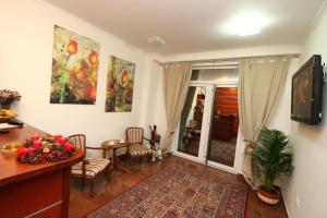 TV a/nebo společenská místnost v ubytování Guesthouse Villa Inn