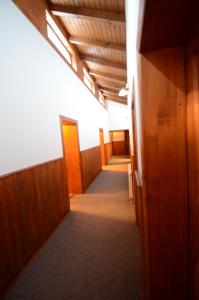 a corridor of an office with wooden doors and a hallway at Salas-Partizanske in Partizánske