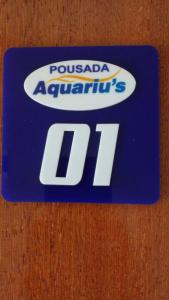 a blue sign with the words poulada appliancesil at Aquariu's Pousada e Restaurante in Cêrro Negro