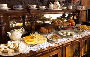 a buffet filled with many different types of food at Gingerbread Mansion in Ferndale +22 photos