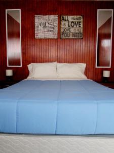 Giường trong phòng chung tại Casa TINY