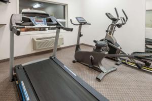 a room with a gym with a treadmill and an exercise bike at Super 8 by Wyndham Edmonton/West in Edmonton