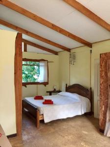 Postel nebo postele na pokoji v ubytování Cabañas Moenga