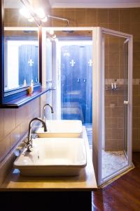 
a bathroom with a sink and a bathtub at Audacia Manor Boutique Hotel in Durban
