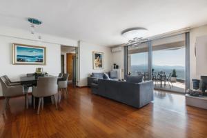 a living room with a couch and a table at DN Sea Apartments in Kalamata