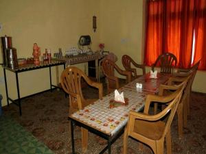 a dining room with a table and chairs at Padma HomeStay - Hanle in Hanle
