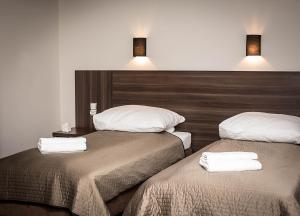 Postel nebo postele na pokoji v ubytování Apartamentowiec Kuźniar
