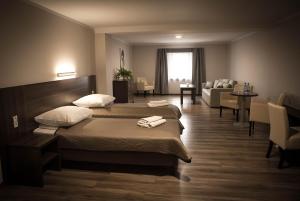 Postel nebo postele na pokoji v ubytování Apartamentowiec Kuźniar