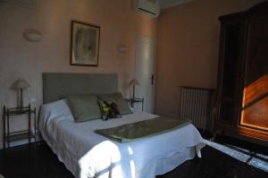 a bedroom with a large bed in a room at Villa Valflor chambres d'hôtes et appartements in Marseille