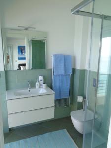a bathroom with a sink and a shower and a toilet at Studio La Florentina in Menton