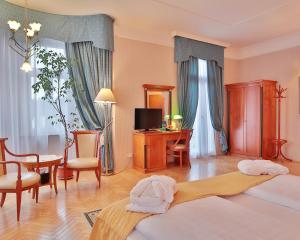 Posteľ alebo postele v izbe v ubytovaní Belvedere Wellness Hotel