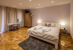 Postel nebo postele na pokoji v ubytování Apartmani studio